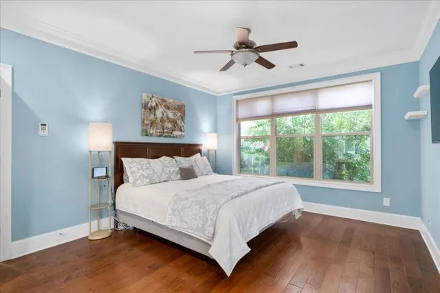 a bedroom with a large bed and a window
