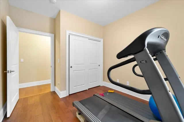 a bedroom with a bed and a view of bathroom