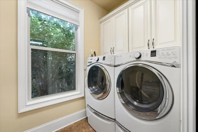 a view of a patio with table and chairs and potted plants