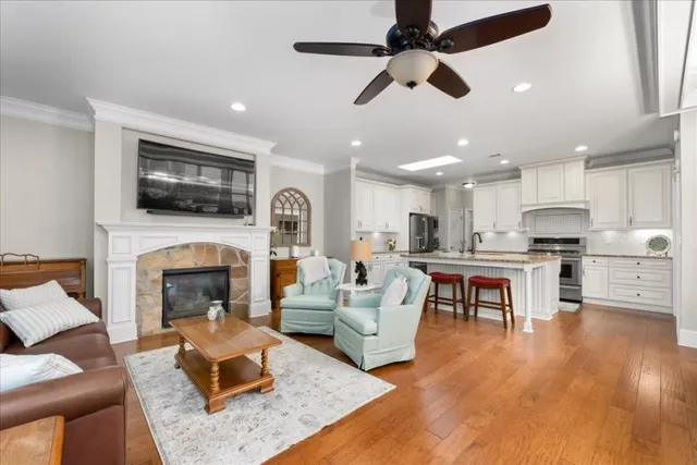 a living room with furniture fireplace and flat screen tv