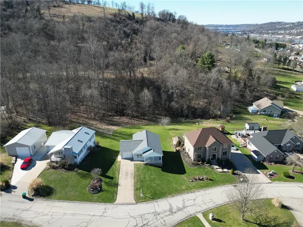 an aerial view of a house with a garden