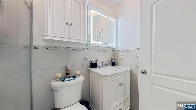 a view of bathroom with a sink and washer