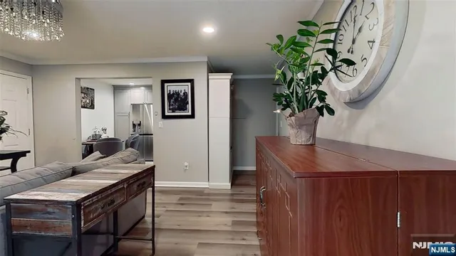 a view of a hallway with dining area