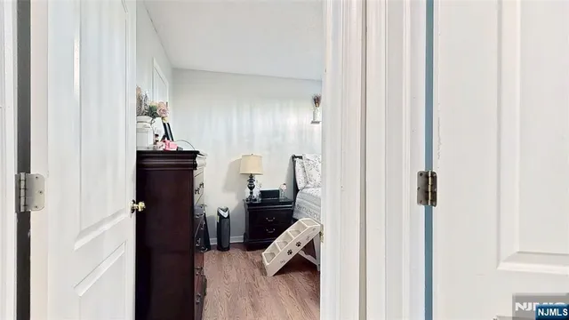 a view of a hallway with living room and furniture