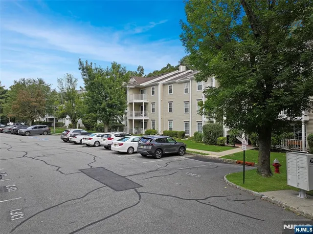 a view of a car parked in front of a house