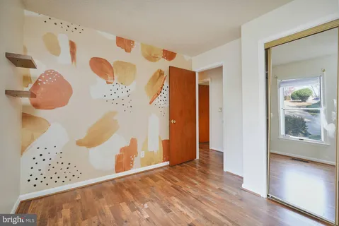 a view of entryway with wooden floor