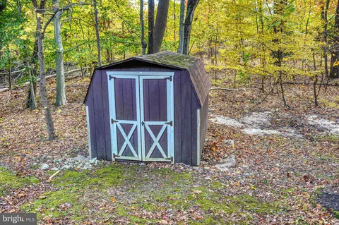 a wooden door in front of a house