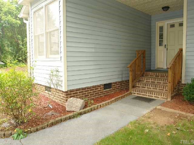 4412 Roller Court Raleigh, NC 27604 - Photo 2 of 12 a view of a house with a door and wooden floor