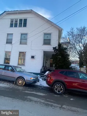 a car parked in front of a house