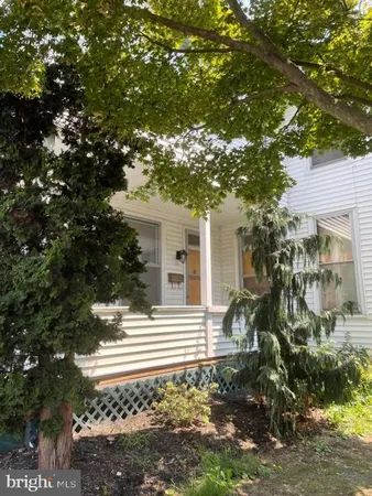 a view of a house with a tree