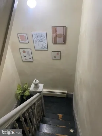 a room with a table and potted plant