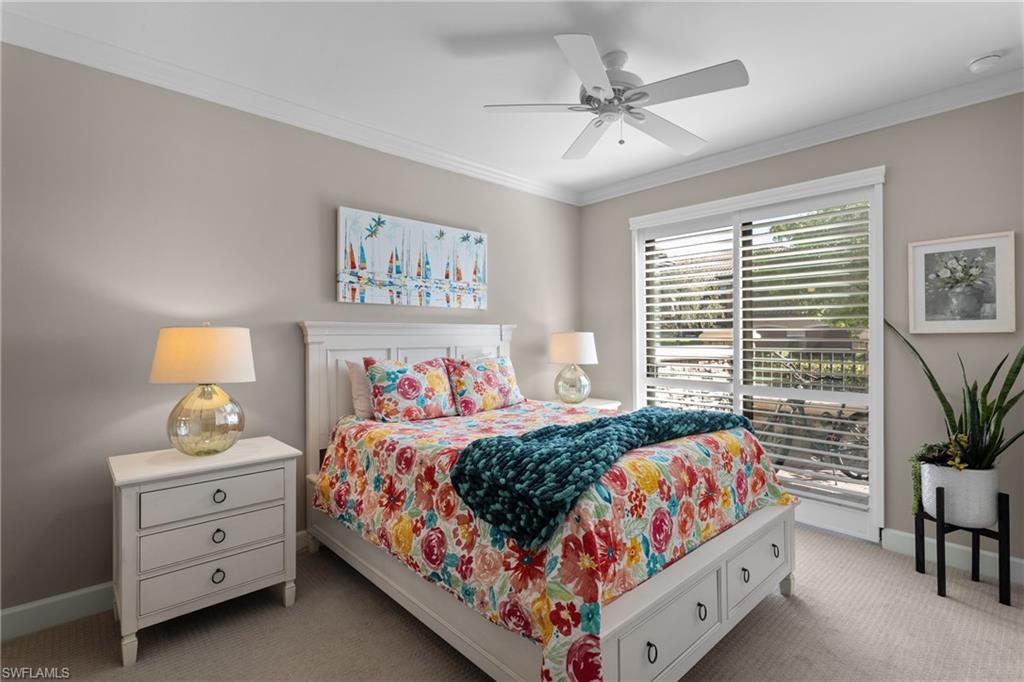 9684 Montelanico Loop, Unit 101 Naples, FL 34119 - Photo 20 of 49 Bedroom featuring light carpet, ceiling fan, and ornamental molding
