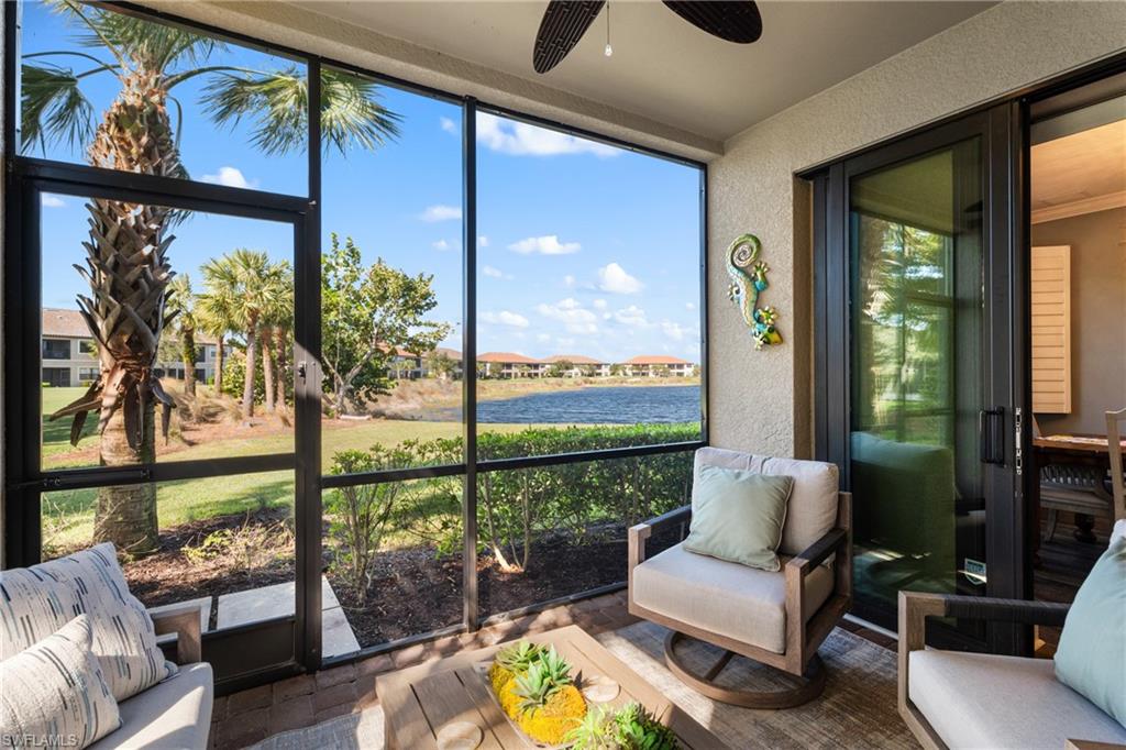 9684 Montelanico Loop, Unit 101 Naples, FL 34119 - Photo 25 of 49 Sunroom / solarium with ceiling fan, a water view, and a wealth of natural light