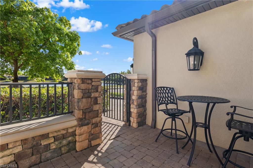 9684 Montelanico Loop, Unit 101 Naples, FL 34119 - Photo 28 of 49 View of patio / terrace