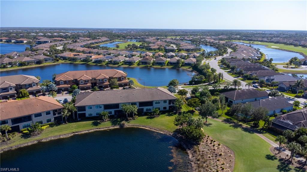 9684 Montelanico Loop, Unit 101 Naples, FL 34119 - Photo 33 of 49 Drone / aerial view with a water view