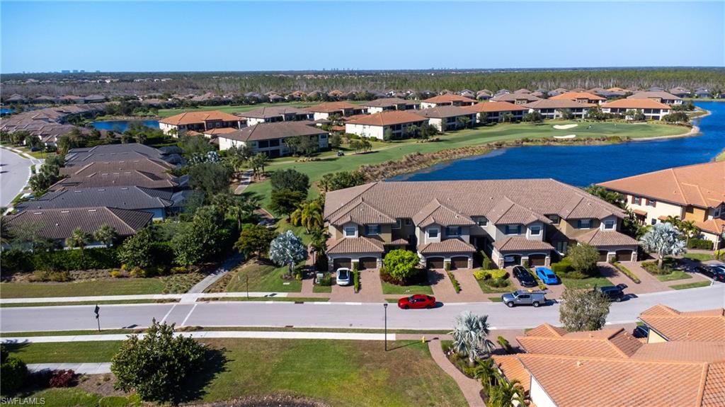 9684 Montelanico Loop, Unit 101 Naples, FL 34119 - Photo 34 of 49 Aerial view with a water view