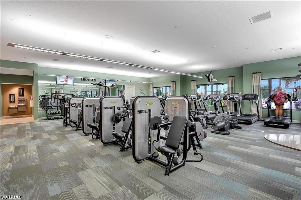 9684 Montelanico Loop, Unit 101 Naples, FL 34119 - Photo 45 of 49 Workout area featuring light carpet