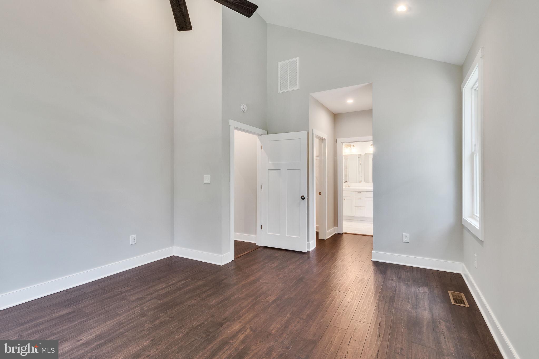 57 Waterman's Way Reedville, VA 22539 - Photo 15 of 43 Primary bedroom, cathedral ceiling, ceiling fan