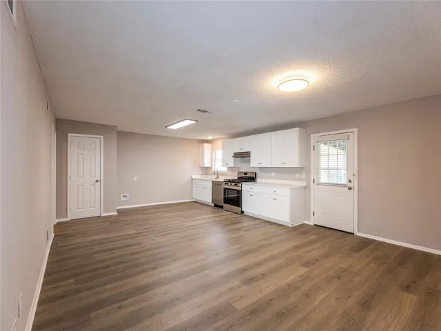 a view of a kitchen with a sink cabinets and a window