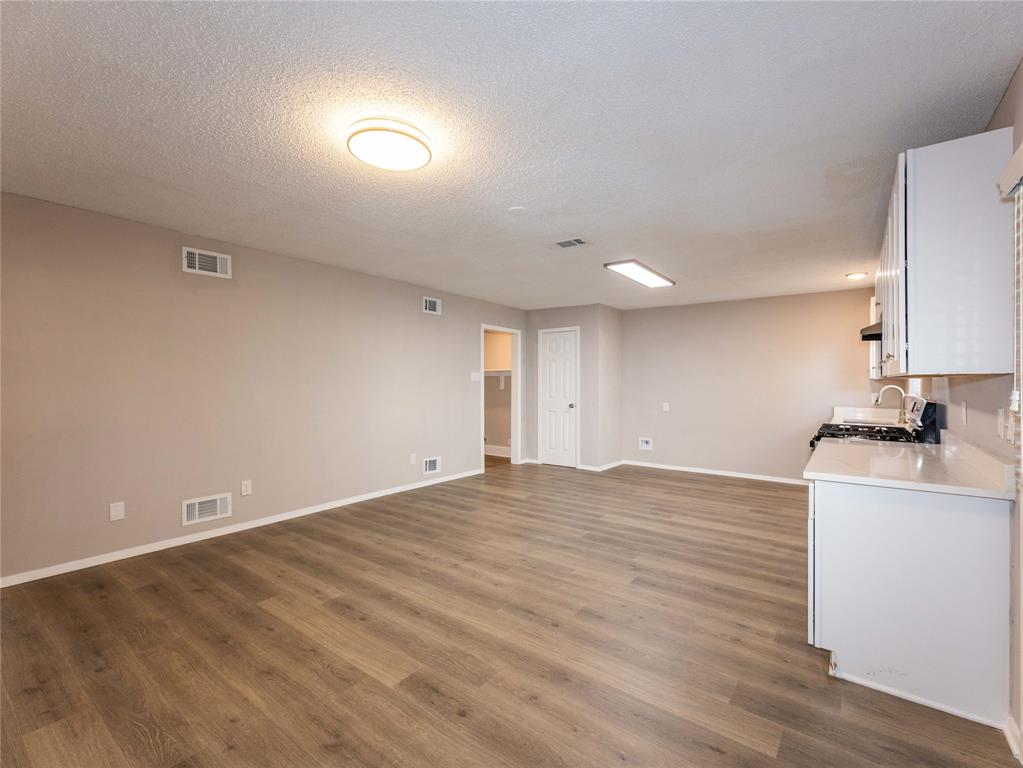 1932 Mars Drive Garland, TX 75040 - Photo 8 of 27 a view of a kitchen with a sink and a stove
