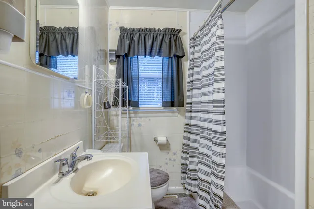 a bedroom with a bed and a closet