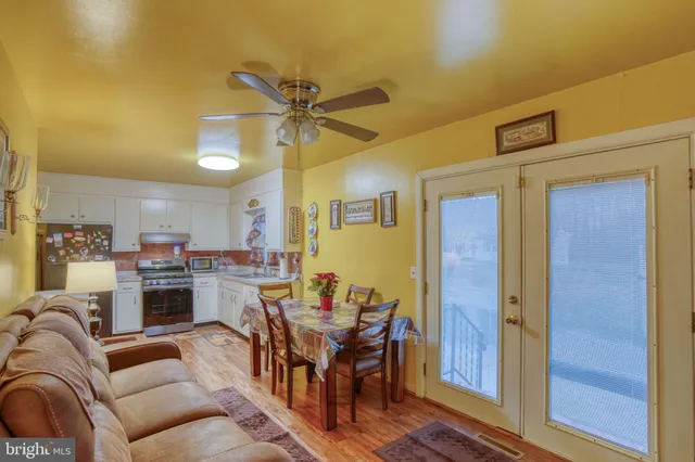 a living room with furniture and a lamp