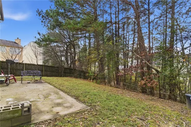 a view of a yard with trees