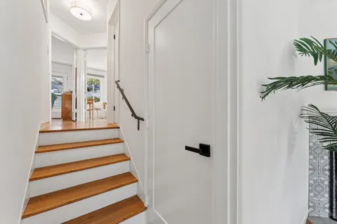 a bedroom with a large bed and a couch