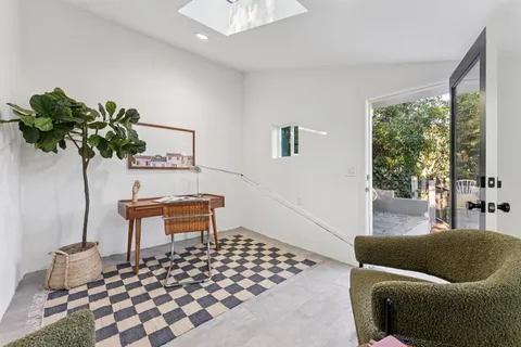 a bedroom with a bed and a lamp