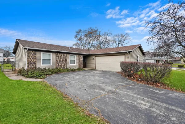 front view of a house with a big yard