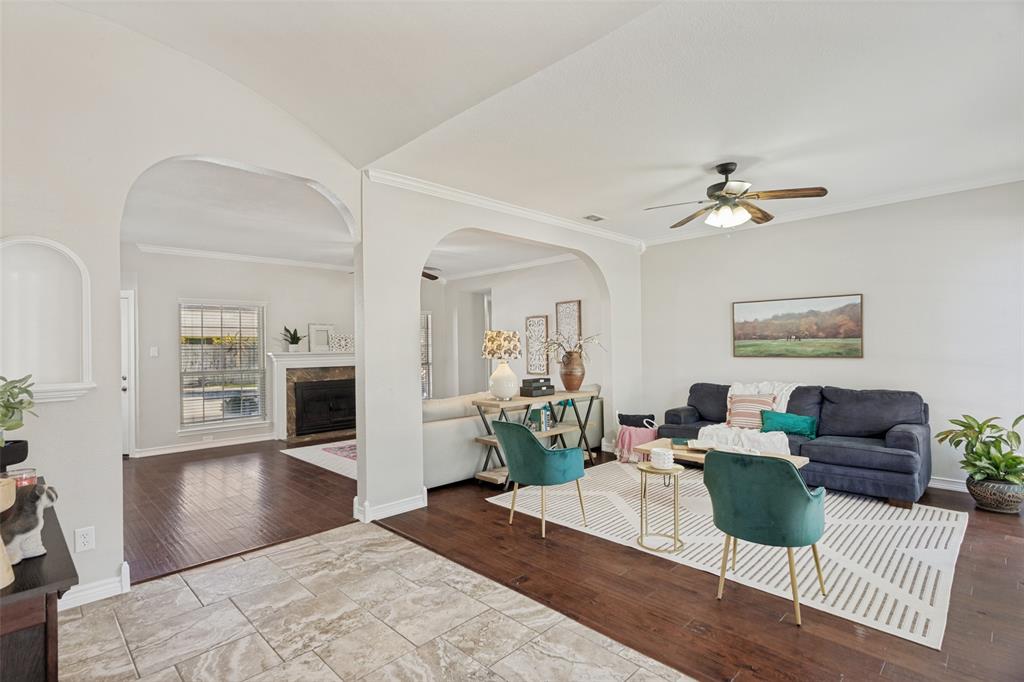 1228 Concho Drive Benbrook, TX 76126 - Photo 6 of 39 Spacious living area featuring wood-finish flooring, a ceiling fan, and crown molding