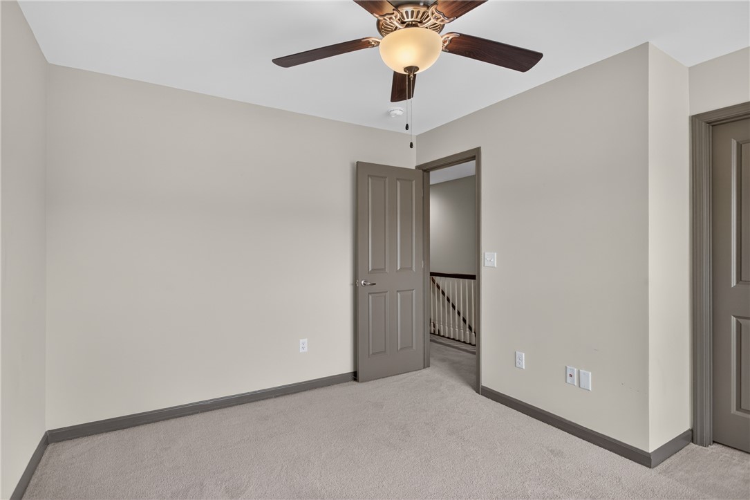 235 Pendleton Road, Unit K1 Clemson, SC 29631 - Photo 34 of 49 Comfortable bedroom with plush carpeting and a modern ceiling fan, offering a serene personal retreat.