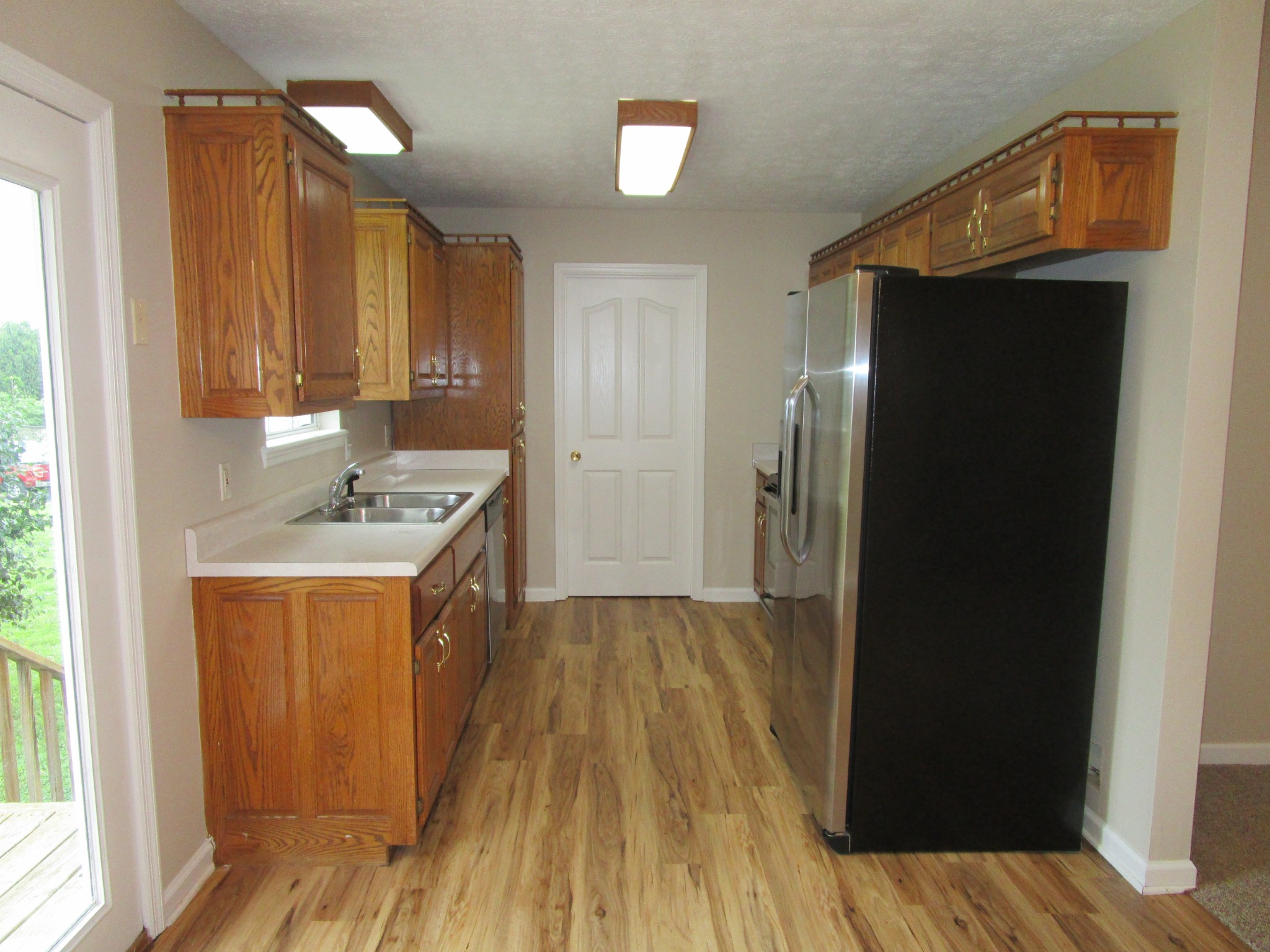 619 Lear Road Portland, TN 37148 - Photo 23 of 43 a hallway view with wooden floor and staircase