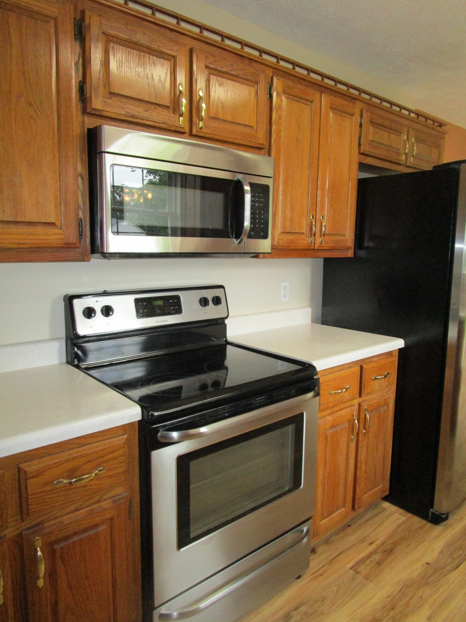619 Lear Road Portland, TN 37148 - Photo 26 of 43 a kitchen with wooden cabinets and a stove top oven