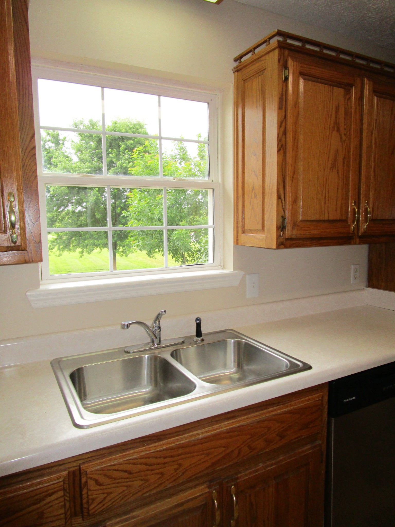 619 Lear Road Portland, TN 37148 - Photo 29 of 43 a kitchen with a sink a refrigerator and window