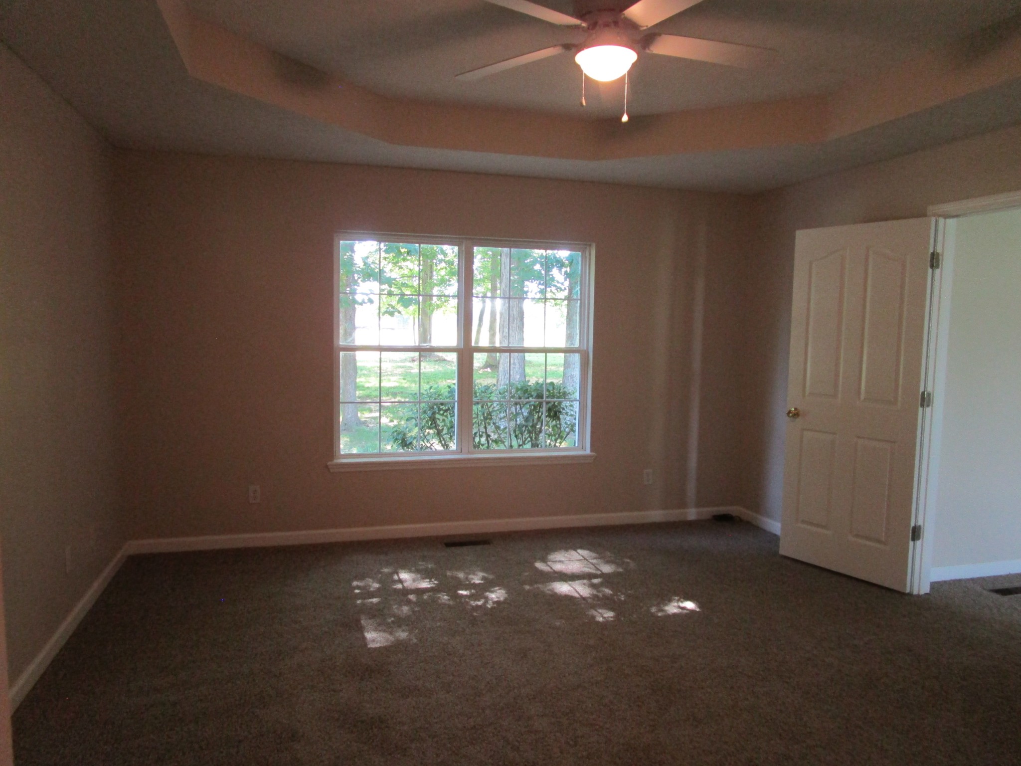 619 Lear Road Portland, TN 37148 - Photo 32 of 43 an empty room with a window and a fan