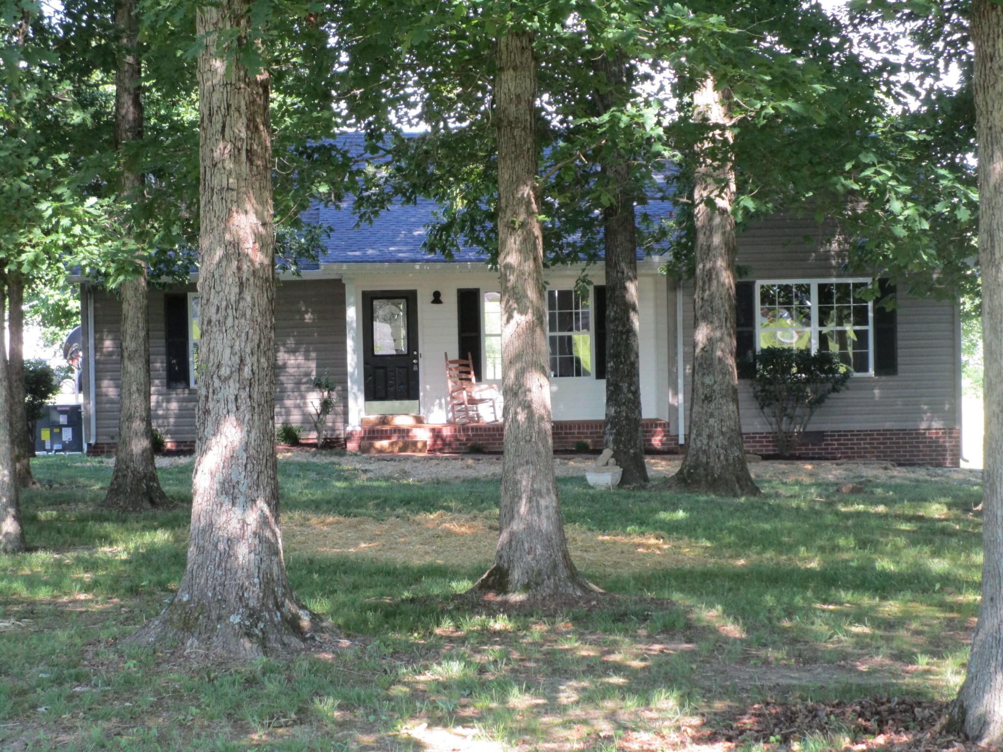 619 Lear Road Portland, TN 37148 - Photo 4 of 43 a front view of a house with a garden