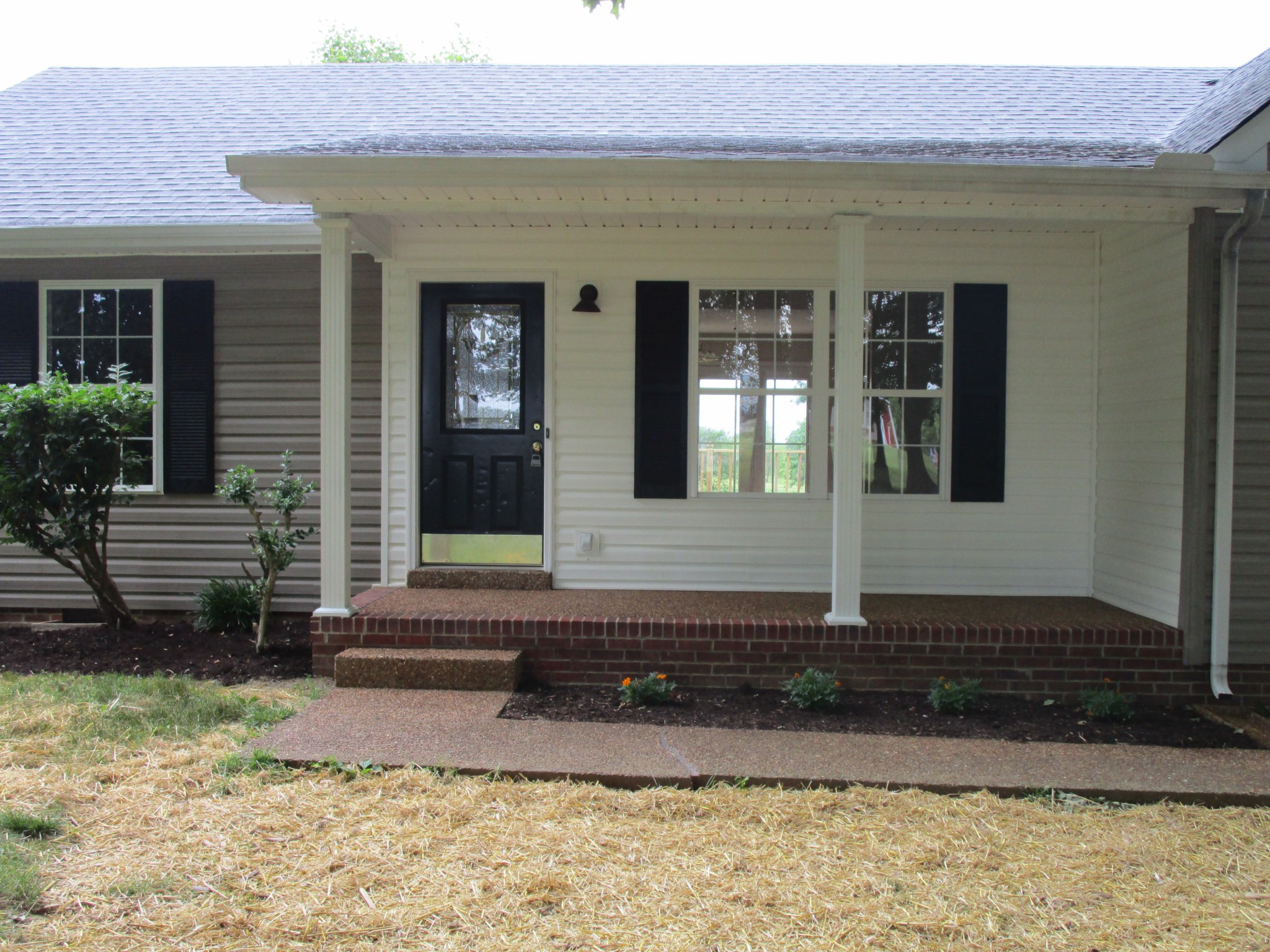 619 Lear Road Portland, TN 37148 - Photo 7 of 43 a front view of a house with a yard