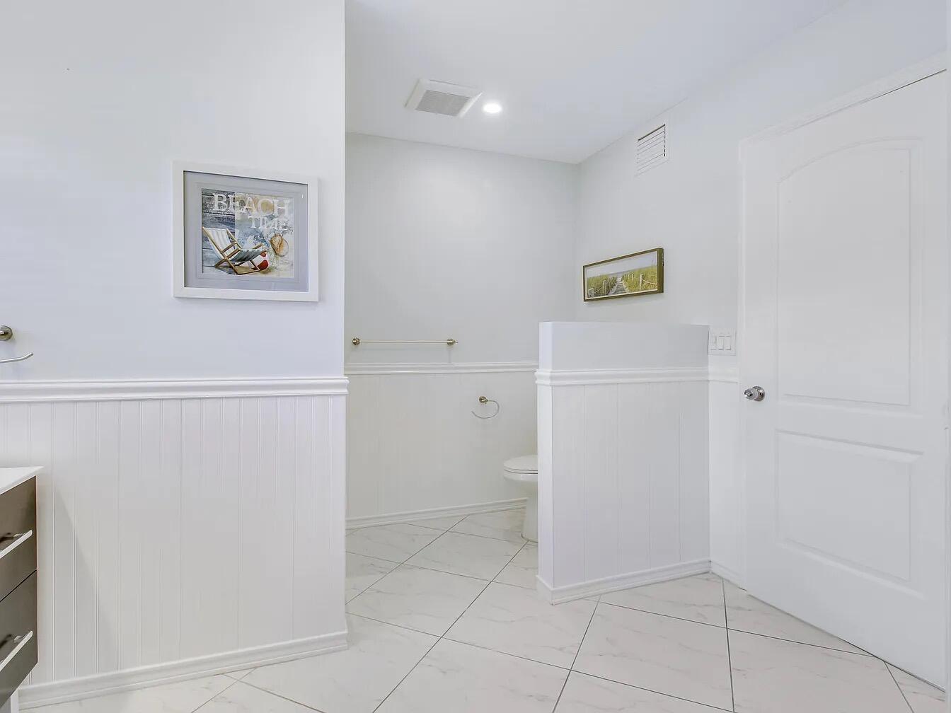 1310 Manor Drive Singer Island, FL 33404 - Photo 11 of 25 a view of a hallway with closet
