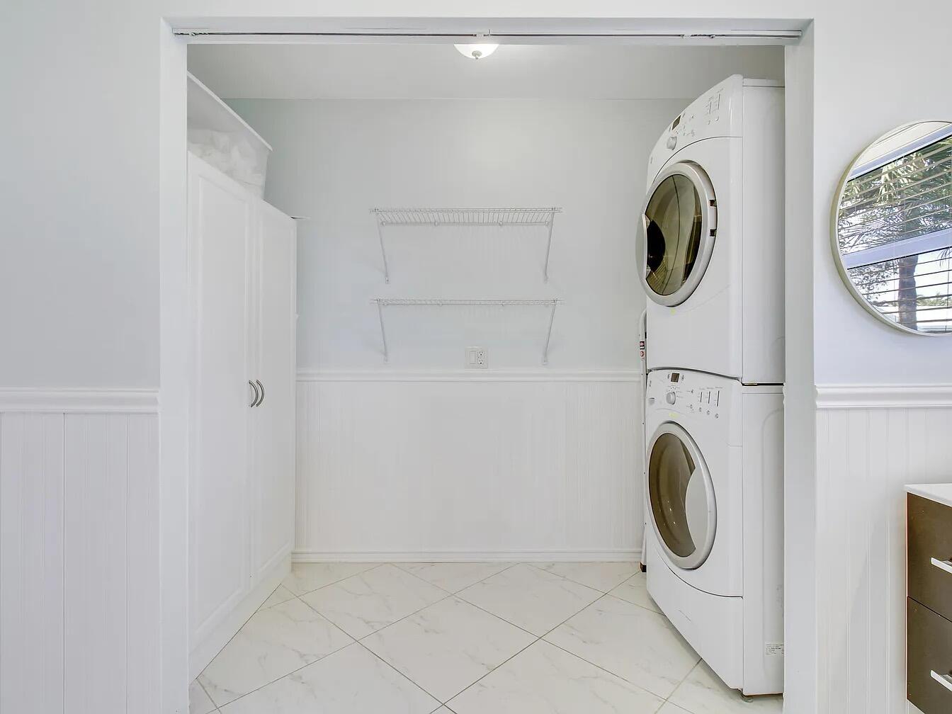 1310 Manor Drive Singer Island, FL 33404 - Photo 12 of 25 a utility room with dryer and washer
