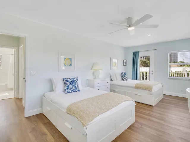 a bedroom with a large bed and a couch