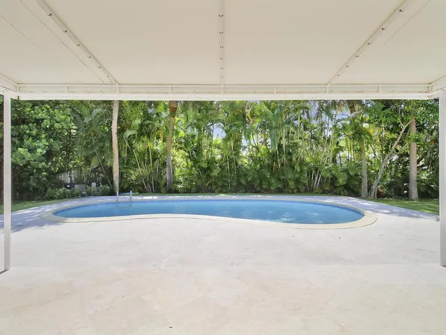 a view of a back yard from a room