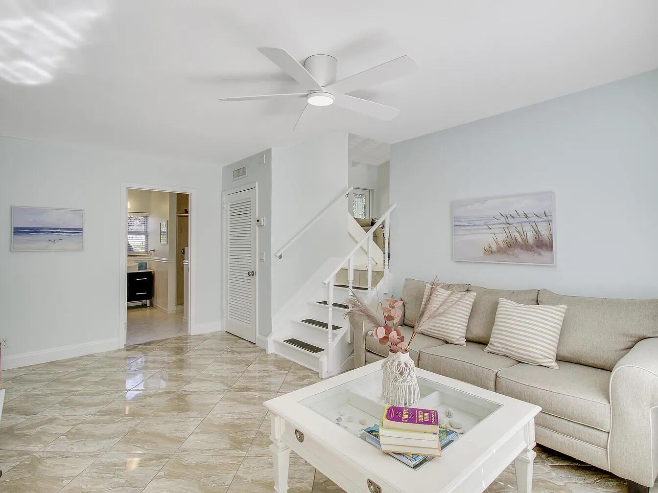 1310 Manor Drive Singer Island, FL 33404 - Photo 9 of 25 a living room with furniture and wooden floor