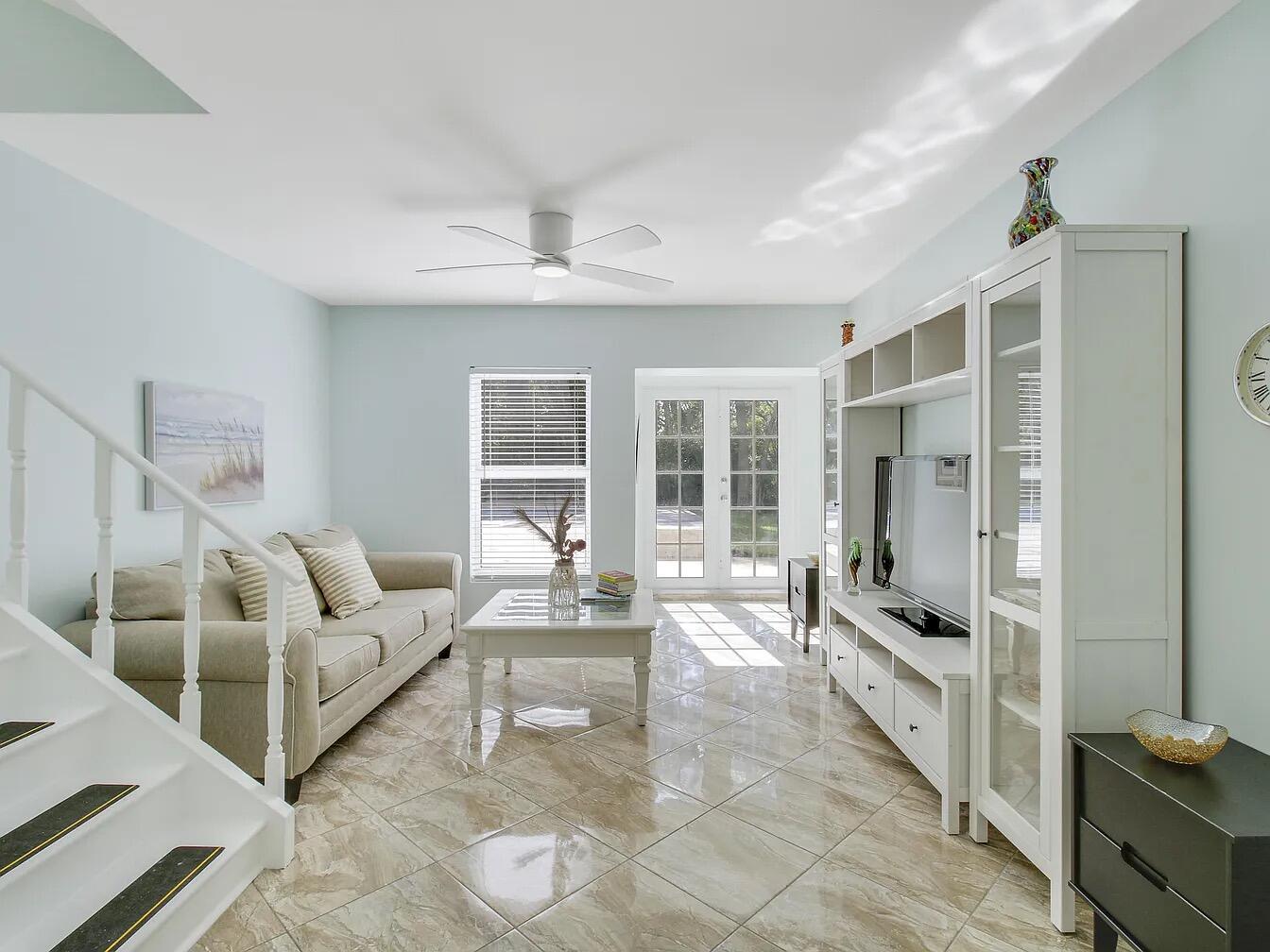 1310 Manor Drive Singer Island, FL 33404 - Photo 10 of 25 a living room with furniture and a flat screen tv
