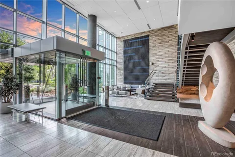 a view of work space with wooden floor and iron stairs