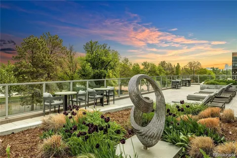 a view of a garden with sitting area