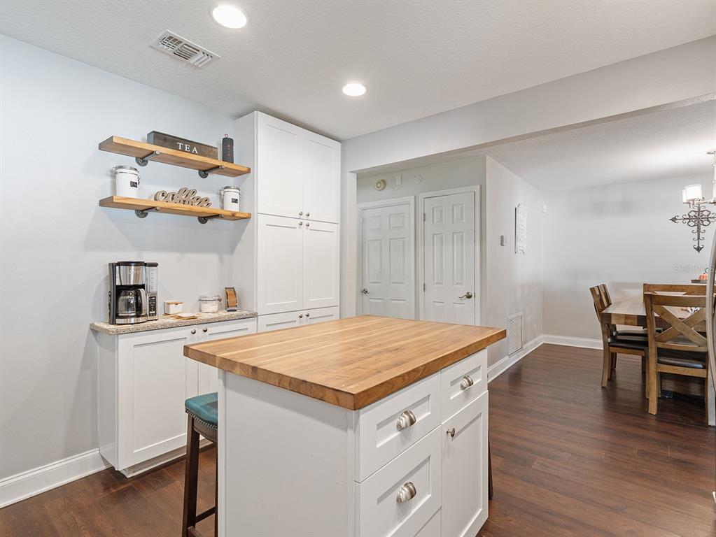 1360 Via Villanova Way Winter Springs, FL 32708 - Photo 11 of 32 a kitchen that has a cabinets and wooden floor