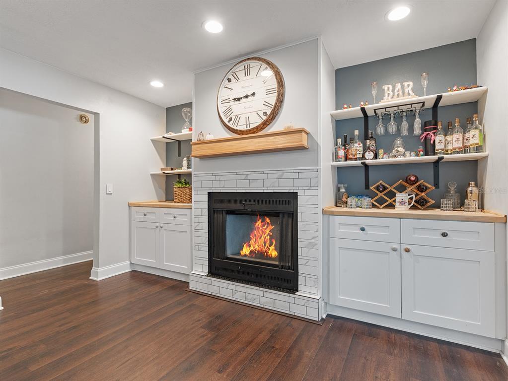 1360 Via Villanova Way Winter Springs, FL 32708 - Photo 14 of 32 a living room with hard wood floors and a fireplace