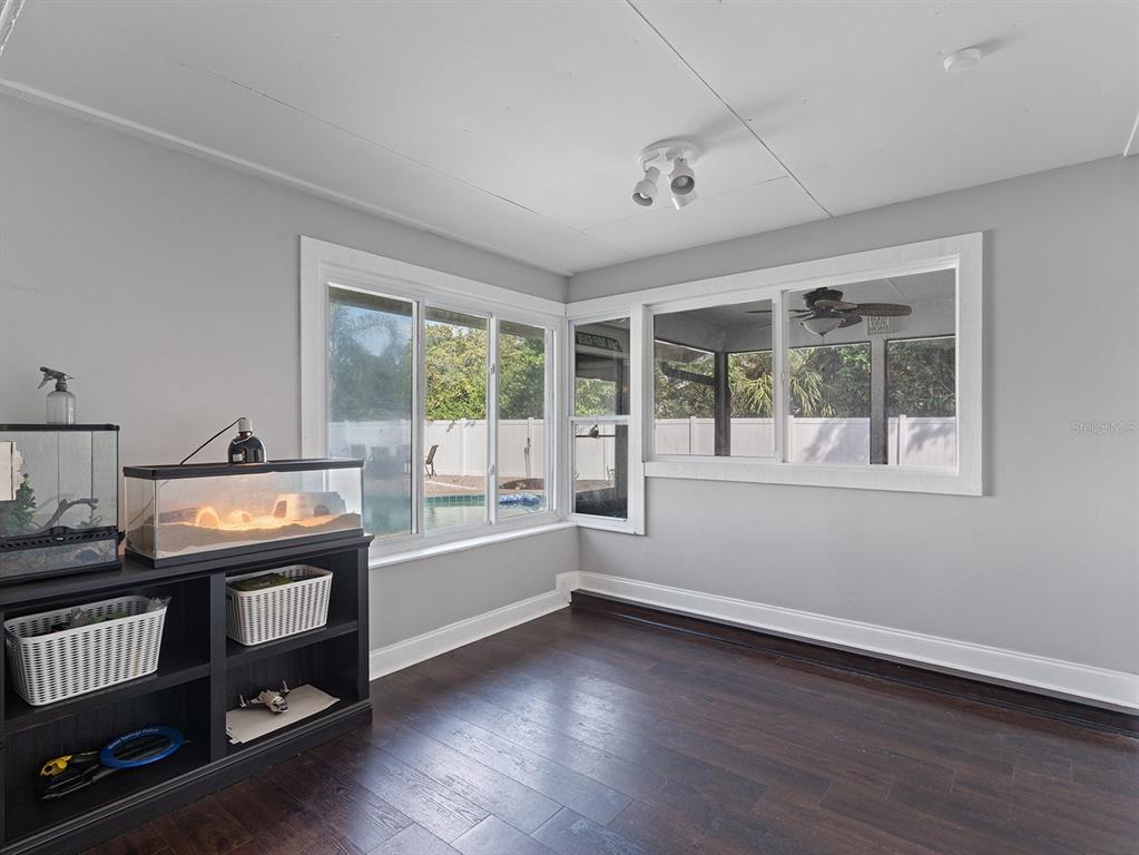 1360 Via Villanova Way Winter Springs, FL 32708 - Photo 15 of 32 a view of a room with wooden floor and windows