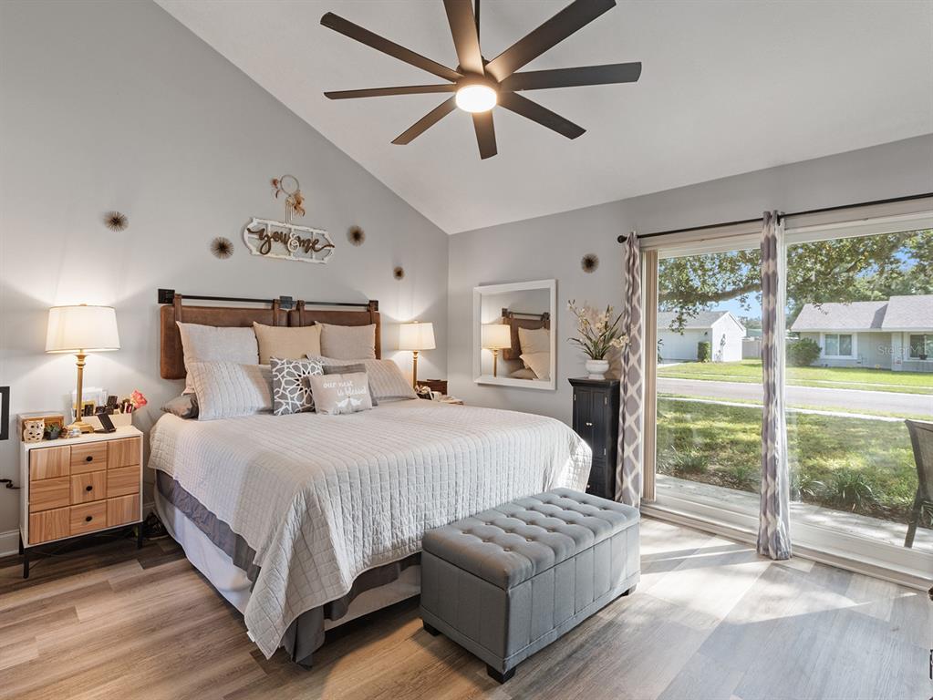 1360 Via Villanova Way Winter Springs, FL 32708 - Photo 16 of 32 a bedroom with a bed and a view of bedroom with window